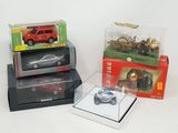 three boxes of toy cars sitting on top of each other