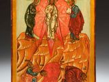 an icon of the resurrection of jesus on a wooden plaque