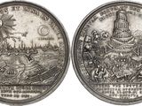 two silver coins with a picture of a castle and a town on them