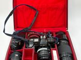 a red case that has a camera and other items in it