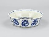 a blue and white bowl with a floral design on it