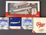 a box of cigarettes next to a model of an airplane