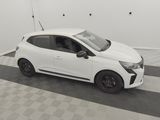 a white car is parked in a garage with a checkered floor