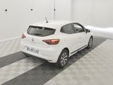 the rear end of a white car parked in a garage