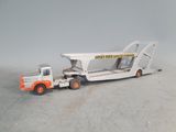 a toy truck with a crane on the back of it