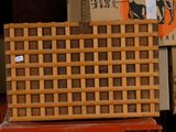 a stack of boxes sitting on top of a red table