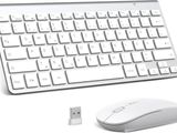 a computer keyboard and mouse sitting next to each other