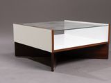 an image of a coffee table with a glass top and wooden legs