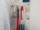 a red pen and a black pen in the package
