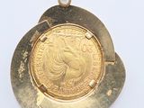 an image of a close up of a gold coin on a white surface