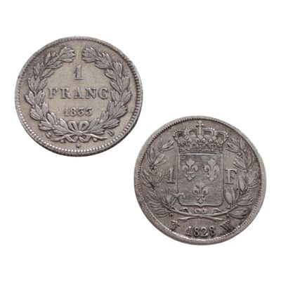 deux pièces d'argent sur lesquelles figure un blason