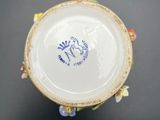 a white plate with a blue and yellow design on it