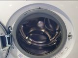 a washing machine that is sitting in a room