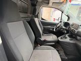 the interior of a van with two seats and a steering wheel