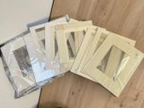 several pieces of paper sitting on top of a table next to a pair of scissors