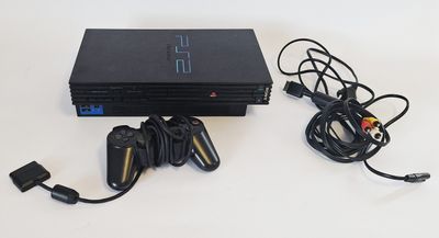 a video game console with two controllers and a charger