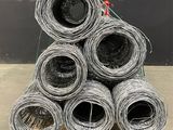 several rolls of barbed wire are stacked on top of each other