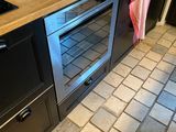an image of a kitchen with a stove and a sink