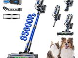 a dog and a cat sitting next to a vacuum