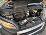 a car with its hood open and the engine in the trunk
