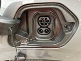 a close up of a car ' s fuel tank with a car plugged into it