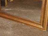a mirror that is sitting on the floor in a room