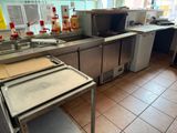 an image of a commercial kitchen with a lot of counter space