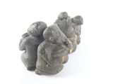 three figurines that are sitting on a white surface