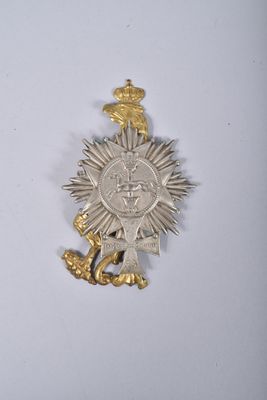 une image représentant une médaille d'argent et une médaille d'or sur un fond blanc