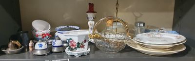 many plates and bowls on the counter in this room