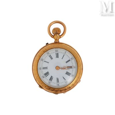 a gold pocket watch with roman numerals on the face