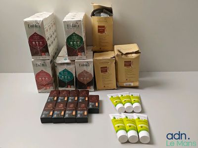 many boxes and packages of coffee on a table