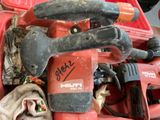 a red tool box with tools in it on a table