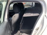 a car with the door open and the seats down