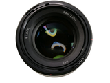 a close up of a camera lens on a white surface