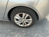 a close up of a car ' s tire on the road