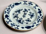 two plates with blue and white designs on them