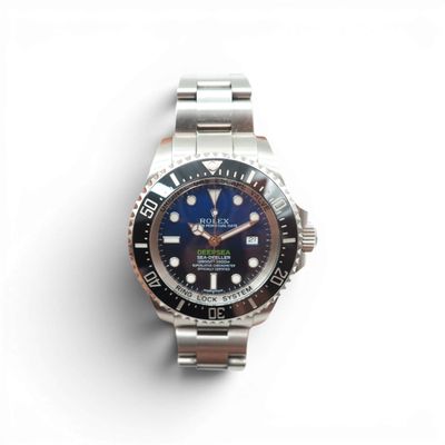 a watch that is sitting on a white surface