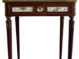 a wooden table with a clock on top of it