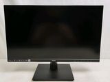 the computer monitor is on a stand on a white surface