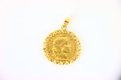 une image représentant une pièce d'or à l'effigie d'une femme