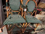 three green and white checkered chairs in a room