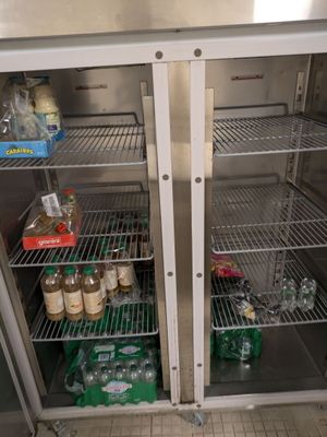 a refrigerator that has a lot of food inside of it