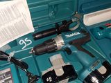 a blue tool box with tools in it on a table