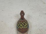 a small figurine that is sitting on a table