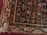 a rug on the floor with a cat laying on top of it