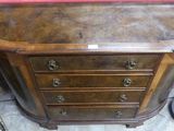 a small wooden dresser with a mirror on top of it