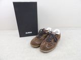 an image of a pair of brown sneakers with a box in the background
