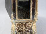 a small clock that is sitting on a table