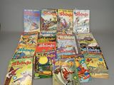 a lot of children ' s books that are on the table